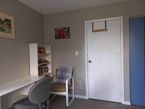a room with a desk and a chair and a door at Sunshine Bayridge in Kingston