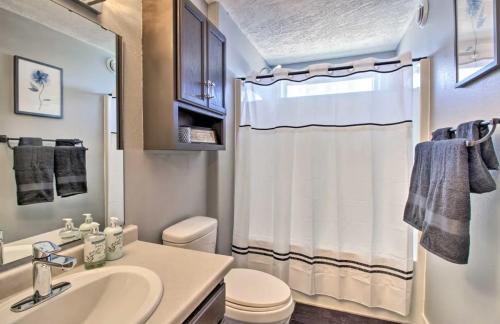 a bathroom with a sink and a toilet and a shower at Welcoming West Fargo Retreat w Backyard in West Fargo