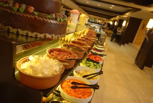 a buffet line with many different types of food at Suhan Cappadocia Hotel & Spa in Avanos