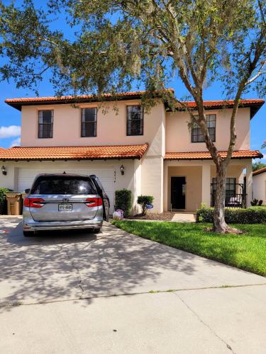 a car parked in front of a house at Luxry villa 6 miles from Disney in Orlando