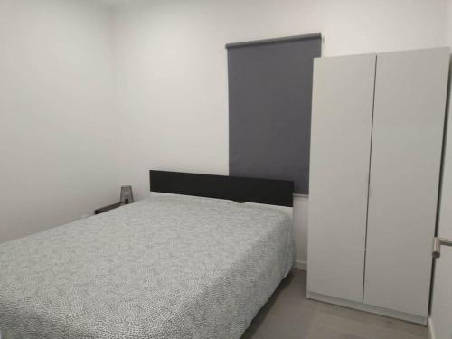 En eller flere senge i et værelse på Casa dos Novelões