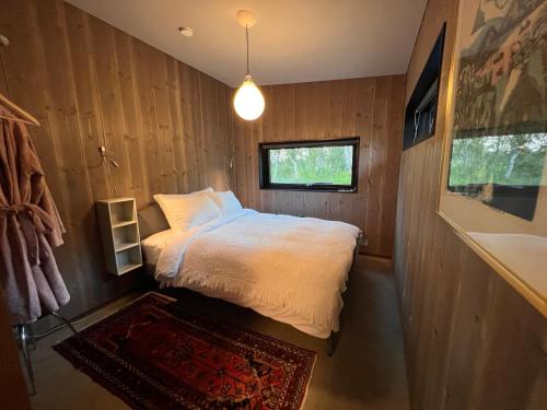 Postel nebo postele na pokoji v ubytování Håkøya Lodge