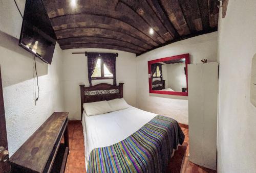 Ένα ή περισσότερα κρεβάτια σε δωμάτιο στο Hostal Antigüeño