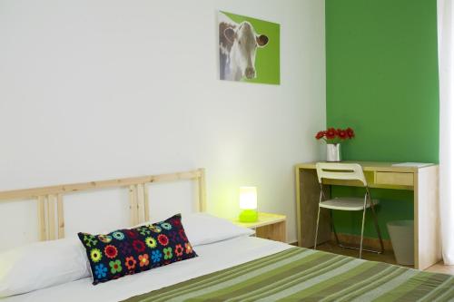 Ένα ή περισσότερα κρεβάτια σε δωμάτιο στο B&B La Gatta Bianca