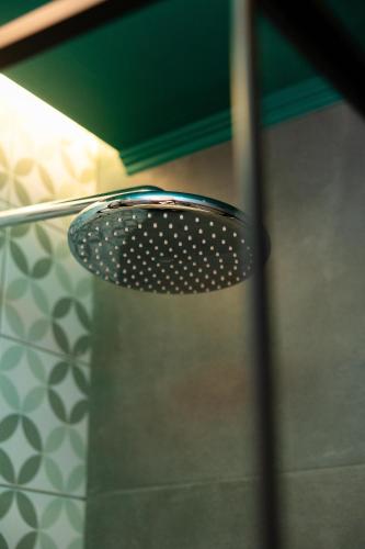 a glass table in front of a shower at Valaoritou 3 Luxury Rooms in Thessaloniki