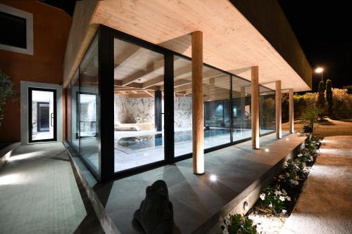 an external view of a house with glass windows at Campo Di Fiori, Maisons de Charme in Calvi