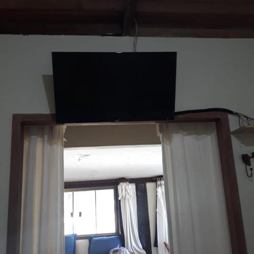 TV a/nebo společenská místnost v ubytování Pousada Ceu e Serra
