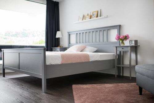 a bedroom with a bed and a table and a window at KELLER APARTMENT in Sulz am Neckar
