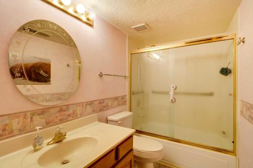 a bathroom with a sink and a shower with a mirror at Albuquerque Home with Spacious Yard and Fire Pit! in Albuquerque