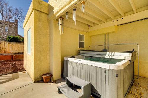 a hot tub on the side of a house at Albuquerque Home with Spacious Yard and Fire Pit! in Albuquerque