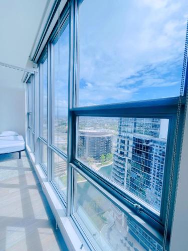 a large window with a view of a city at 25th floor Luxury Penthouse in Santa Ana