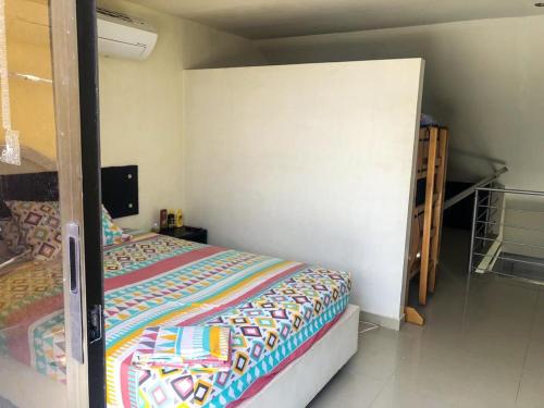 a small bedroom with a bed and a closet at Penthouse Rodadero Norte in Gaira