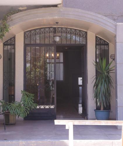 an entrance to a building with a door and a bench at Matts Realestate in Addis Ababa