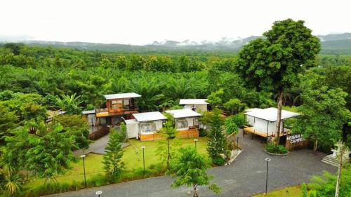 an aerial view of a house in a forest at Heaven Hill Camping in Ban Thung Na