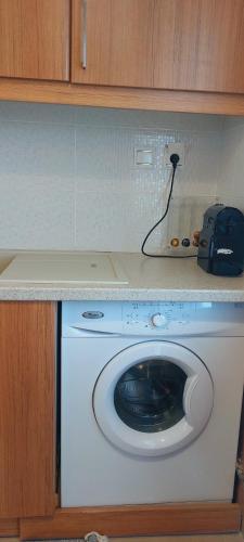 a washing machine with a camera on top of it at Sea Breeze in Agios Nikolaos