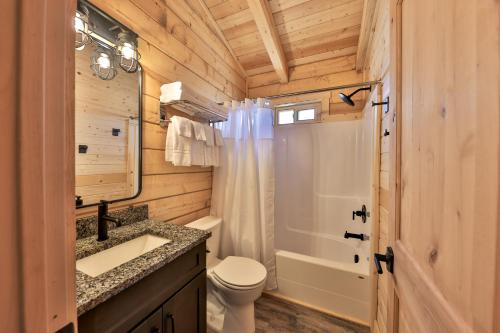 a bathroom with a sink and a toilet and a shower at Pet Friendly Cabins in Hanksville Utah in Hanksville