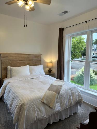 a bedroom with a bed and a large window at The Cottage at 241 North in St. George