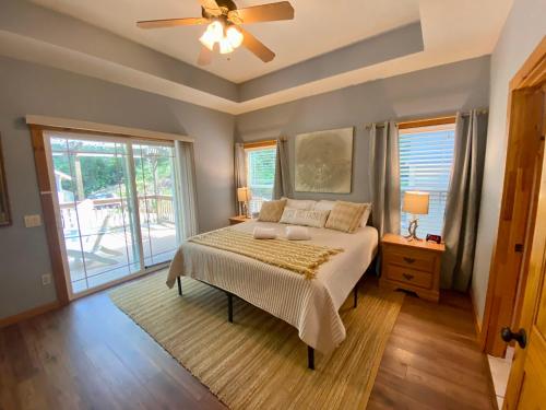 a bedroom with a bed and a ceiling fan at New Listing! Mountainview Escape in Dahlonega