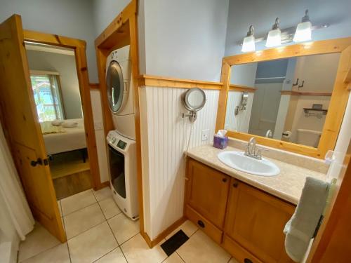 a bathroom with a sink and a mirror at New Listing! Mountainview Escape in Dahlonega