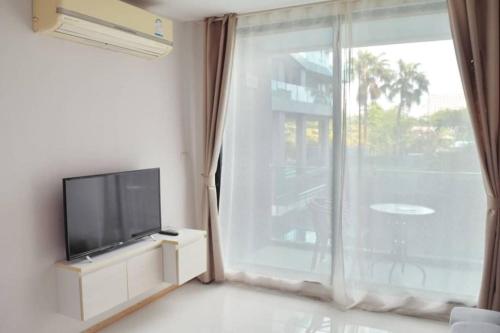 Un televizor și/sau centru de divertisment la Acqua Apartment