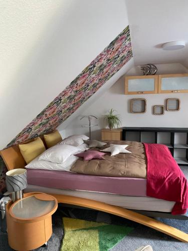 a bedroom with a large bed with at Ferienwohnung Lagedeich in Südermarsch