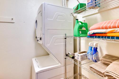 a refrigerator with its door open in a kitchen at New Smyrna Beach Condo Pool Access, Walk to Beach in New Smyrna Beach