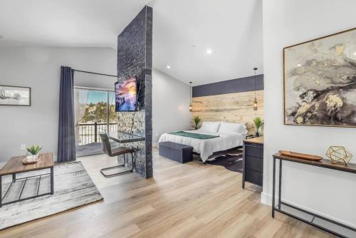 a bedroom with a bed and a desk in a room at Luxury Mountain Escape! in Show Low