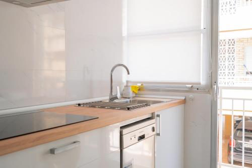 a kitchen with a sink and a counter top at Apartamento en Gran Playa in Santa Pola