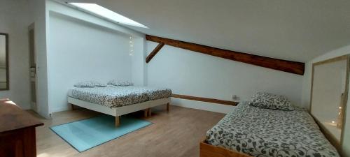 Postel nebo postele na pokoji v ubytování L'éphémère