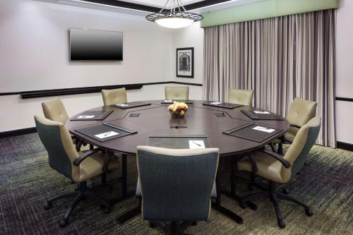 a conference room with a table and chairs at Hampton Inn & Suites Gainesville Downtown in Gainesville