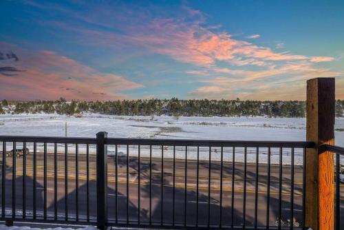 a view of a snow covered field with a fence at Scenic Luxury Villa! in Show Low