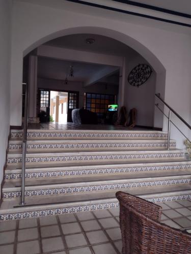a stairway with a set of stairs with a mirror at Pousada A Pérola in Rio de Contas