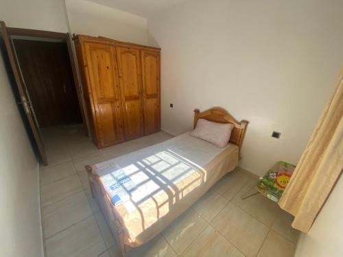Ein Bett oder Betten in einem Zimmer der Unterkunft Appartement avec suite parentale