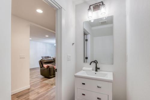 a bathroom with a sink and a mirror at Hideaway in Seaside in Seaside