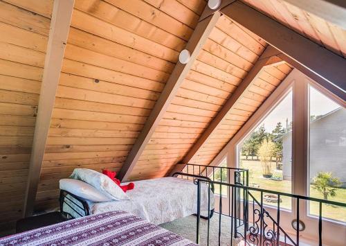 a room with a balcony with a large window at Silver Star in Rockaway Beach