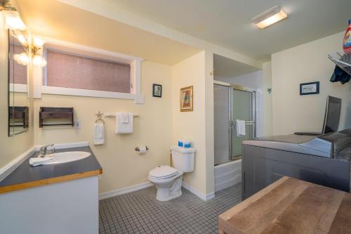 a bathroom with a toilet and a sink at Nyevana Beach House in Newport