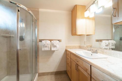 a bathroom with a sink and a shower at Moss Quadrant in Rockaway Beach