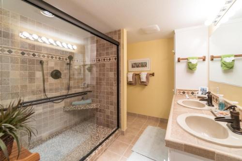 a bathroom with two sinks and a shower at Salt Therapy in Depoe Bay