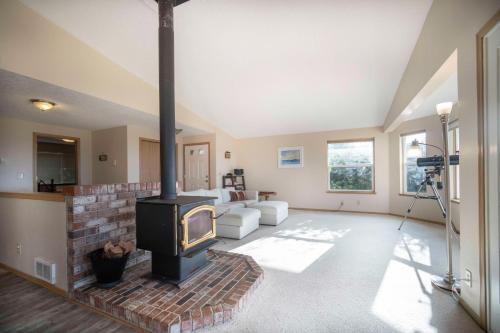 a living room with a wood stove in it at Oceanside Vista in Oceanside