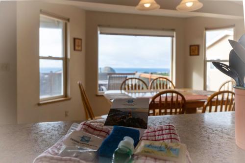 a kitchen with a table with a view of the ocean at Oceanside Vista in Oceanside