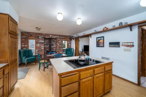 a kitchen with a counter and a dining room at Surfrider Seaside in Seaside