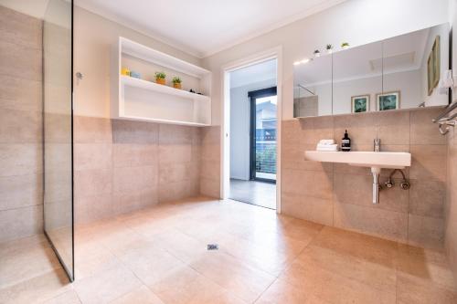 a bathroom with a sink and a shower at Whale Watcher 2 in Coles Bay