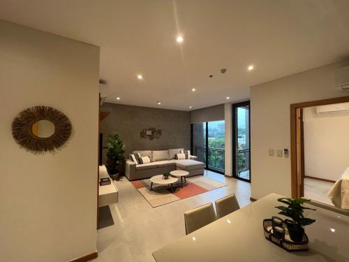 a living room with a couch and a table at Gomez de castro apartments in Asuncion