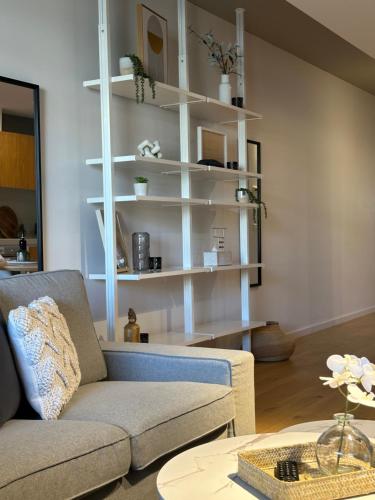 a living room with a couch and a table at Palko - Oasis in the City in Canberra