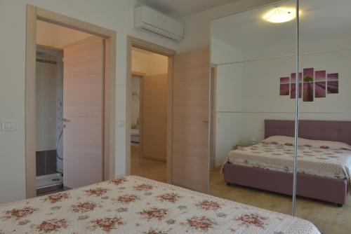 Ένα ή περισσότερα κρεβάτια σε δωμάτιο στο Villa Artemia