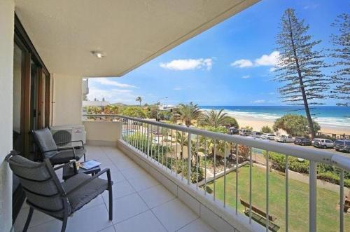 a balcony with a view of the beach and the ocean at Coolum Caprice in Coolum Beach