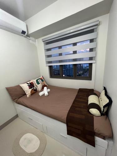 Postel nebo postele na pokoji v ubytování Cozyhome by LV & SG - S residences MOA PASAY unit condo
