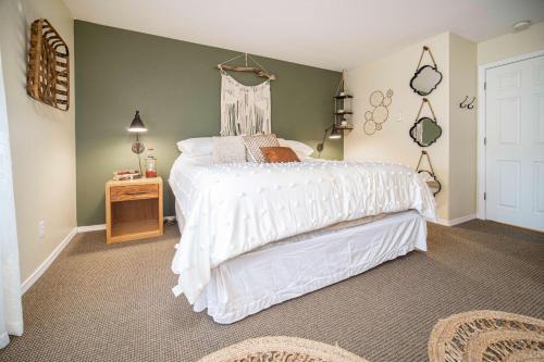 a bedroom with a bed with a white bedspread at Waters Edge 304 in Lincoln City