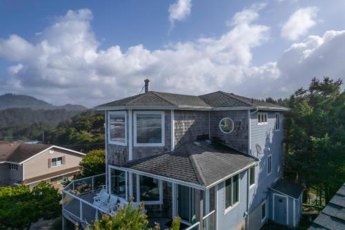 a house with a cross on top of it at Beverly Beach Overlook in Newport