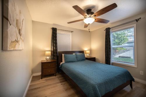 a bedroom with a bed and a ceiling fan at Just Beachy in Lincoln City